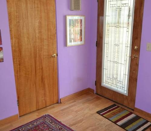 Upon entering the home your will enjoy the lead glass door.  It entry features a coat closet and hardwood flooring.  This is the perfect spot for  welcoming your guest.
