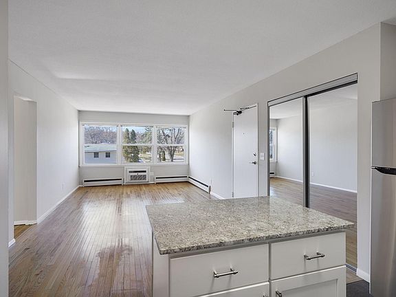 Kitchen looking into dining and living rooms