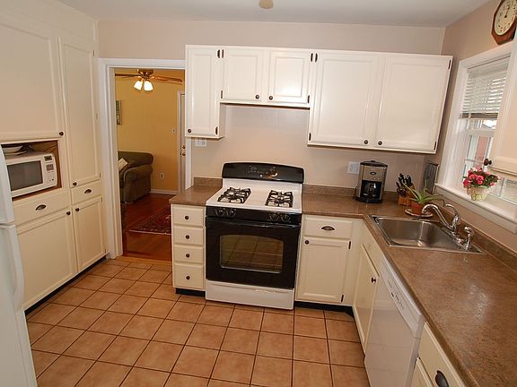 Large Kitchen with new Stove, Dishwasher, Disposer, Sink and Counter Tops.
