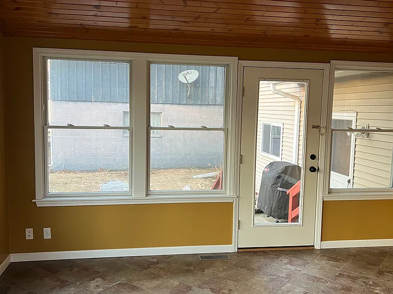 Door to patio off of four season (Florida) room