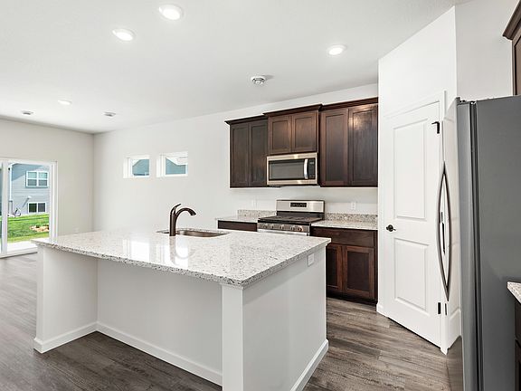 This modern kitchen will quickly become everyone s favorite hangout.
