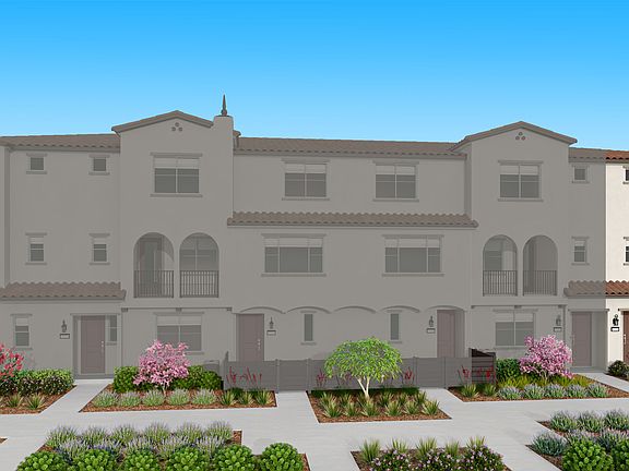 A multi-story residential building with a Mediterranean-style architecture, surrounded by a well-man