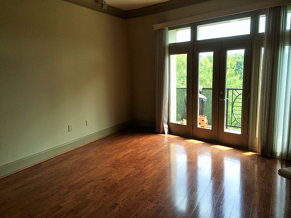 The living room with french doors to the balcony.