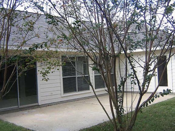 WOODED BACKYARD WITH EXTENDED PATIO. PERFECT FOR THE OUTDOOR
