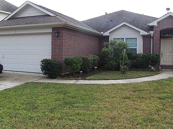 2 Car Attached Garage with Double Wide Driveway and Covered Porch Entry