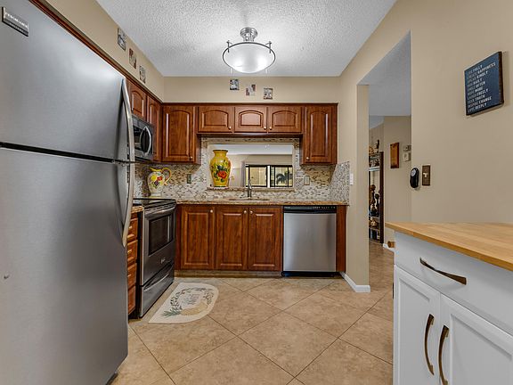 4th image of 7340 AMBERLY Lane #210