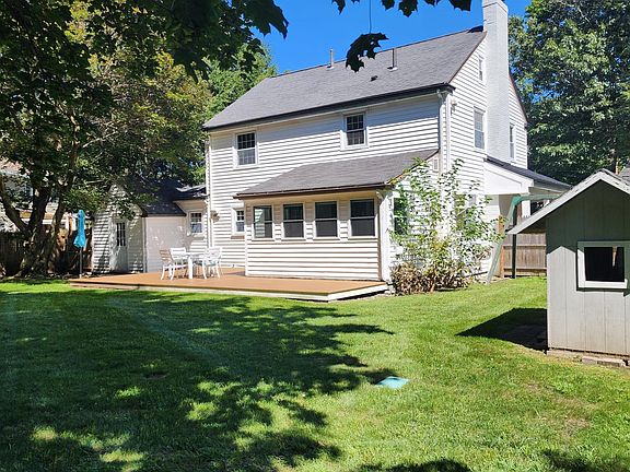 Backyard with small 'clubhouse' for kids.