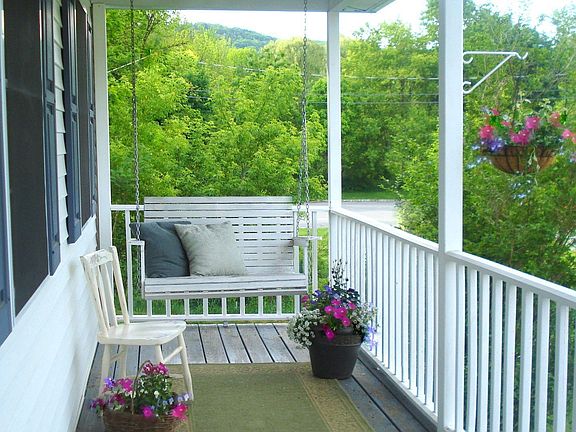 Relax on the Porch Swing while visiting w/ neighbors!