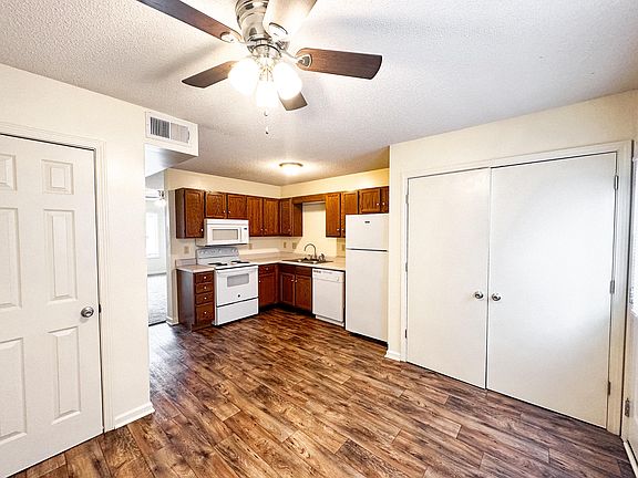 Dining room with view of washer-dryer hookups closet, and water heater closet.