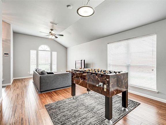 Plenty of room to entertain in this spacious living area. Check out the lighting.  This home is not just spotless, it's spot on!