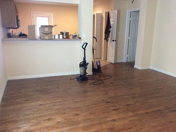 Living area open to kitchen. As you can see tenant still nee