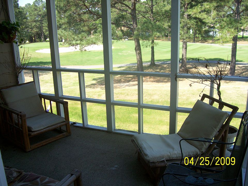 View from screened porch overlooking golf course