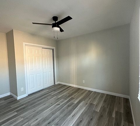 The second bedroom is spacious and adaptable, making it ideal for a guest room, home office, or children's room. With large windows that bring in plenty of natural light and ample closet space, it offers both comfort and functionality.