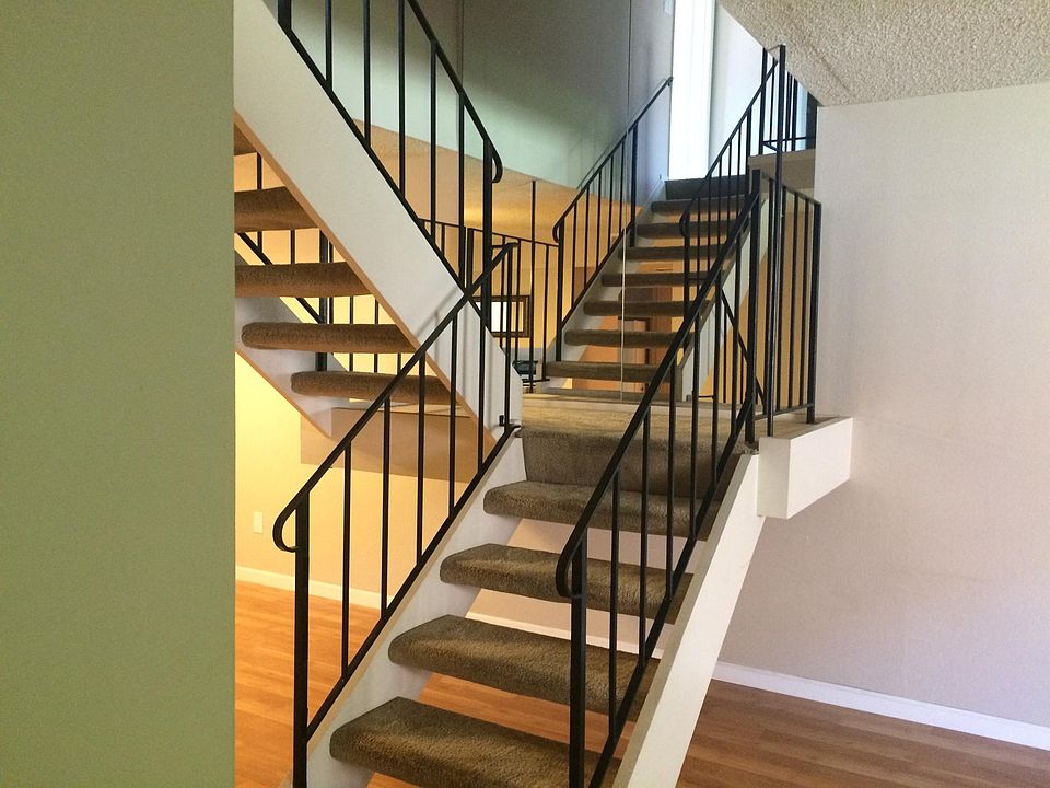 Airy, carpeted stairwell to second floor...