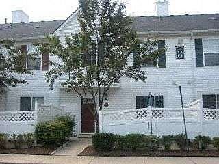 Exterior w/ fenced private patio.