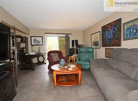 Living Room Looking Toward Back Patio.  Note Ceramic Tile Floor.
