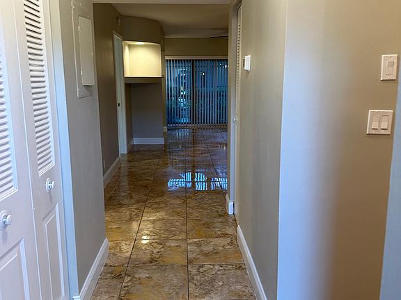 Hallway and Pantry leading into Living Room and Kitchen