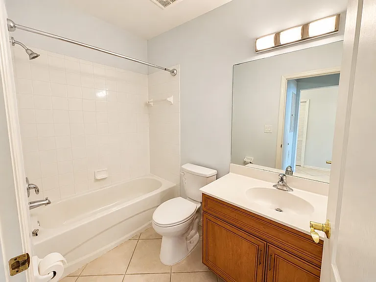 Second full bathroom with tub and shower combination