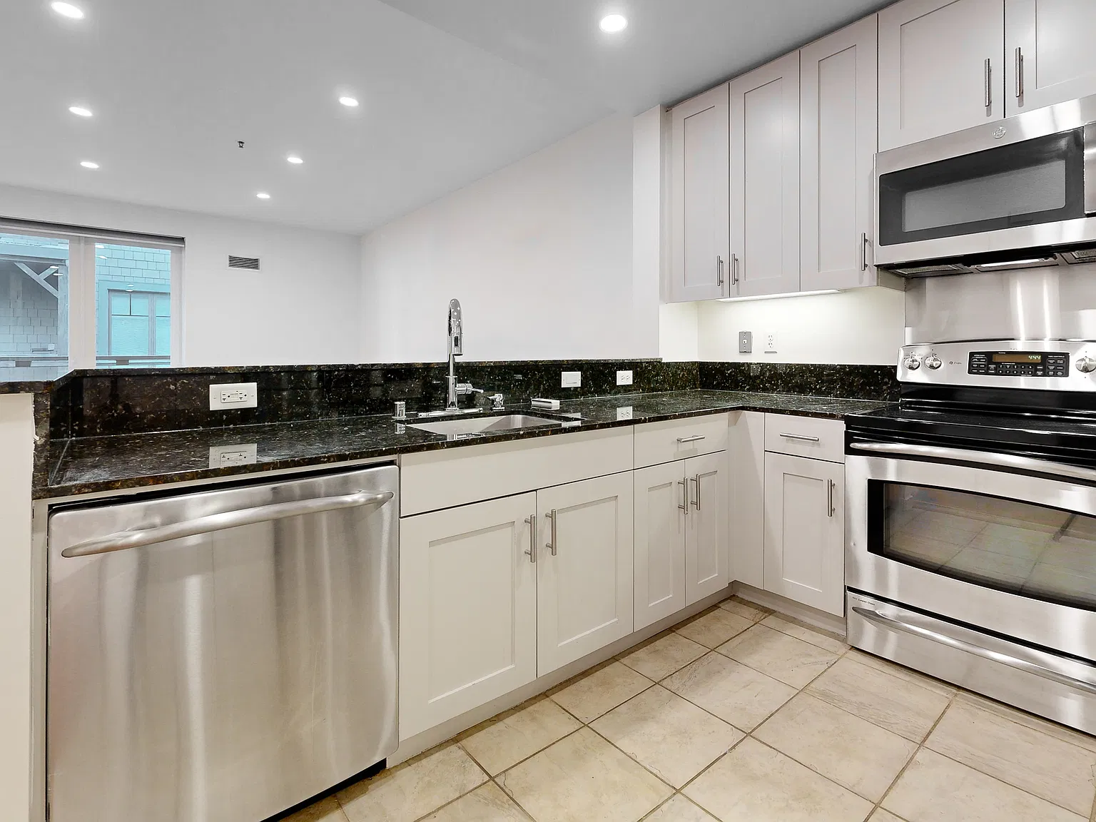 Spacious Two-Level Condo with EV Parking Included — Photo 4