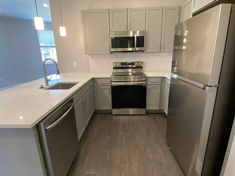 Kitchen with stainless steel Samsung appliances. Kitchen with stainless steel Samsung appliances.