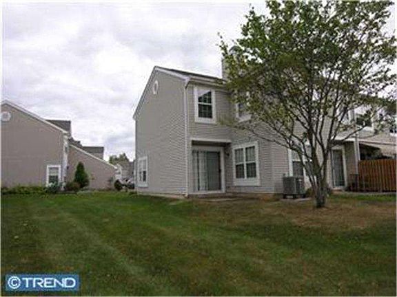 End unit with two patios off living room and kitchen - space