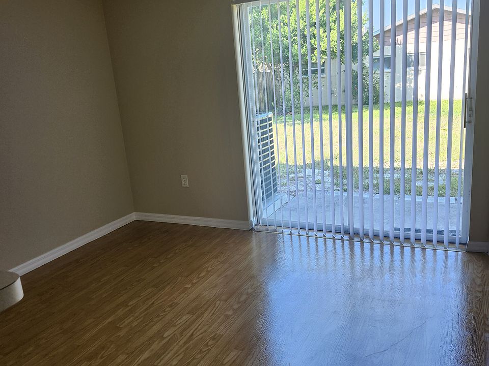 Dining room with patio and back yard on empty lot