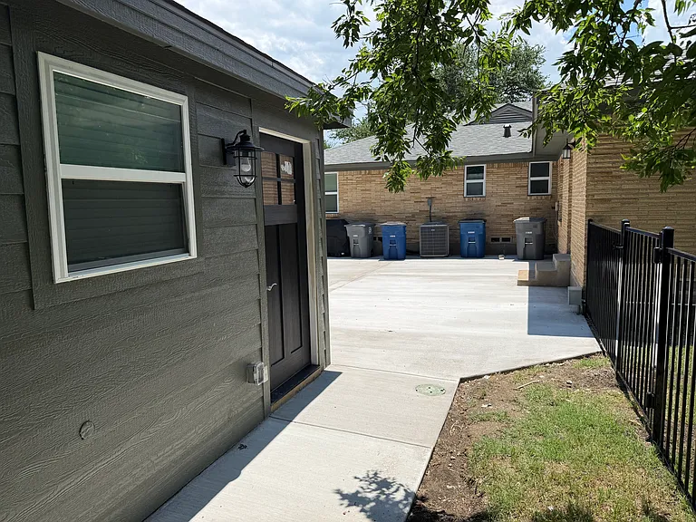 The Guest House is on the left behind the duplex. It has a shared fenced back yard