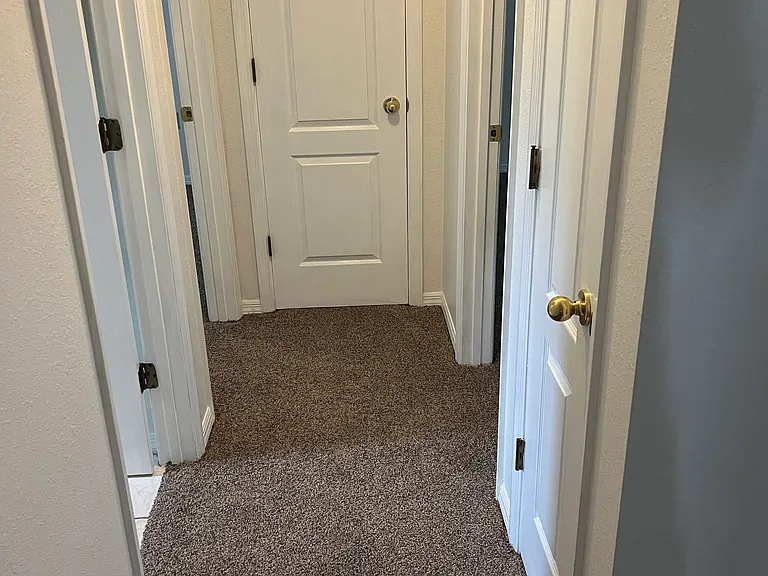 Hallway to bedrooms and bathroom