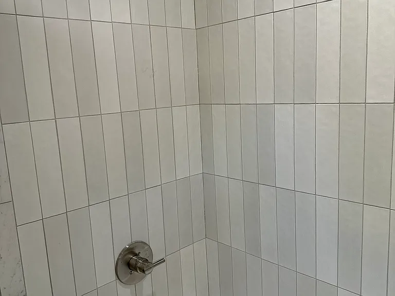 brand new tile shower with delta fixutres