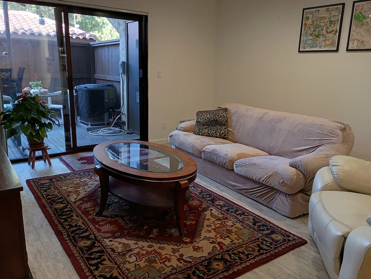 Living room & patio. - 39821 Cedar Blvd #111