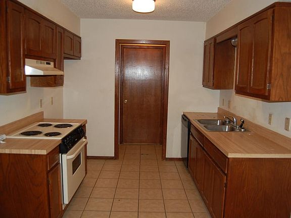 pullman style kitchen with laundry room at the end
