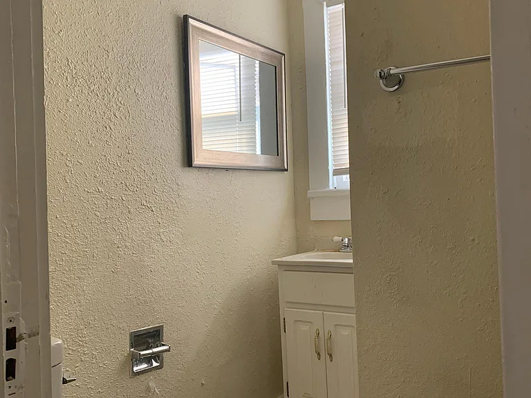 Bathroom has tiled show stall