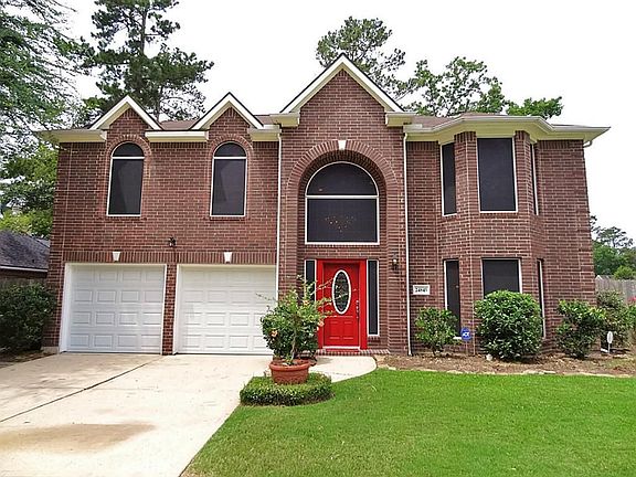 Home has double-wide driveway with 2 garage doors.  These original owners had their Deerwood Home built with double-paned Low-E windows.  Notice the solar screens on all of the windows. This home is ENERGY EFFICIENT!