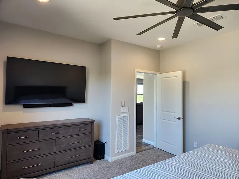 Primary bedroom with TV