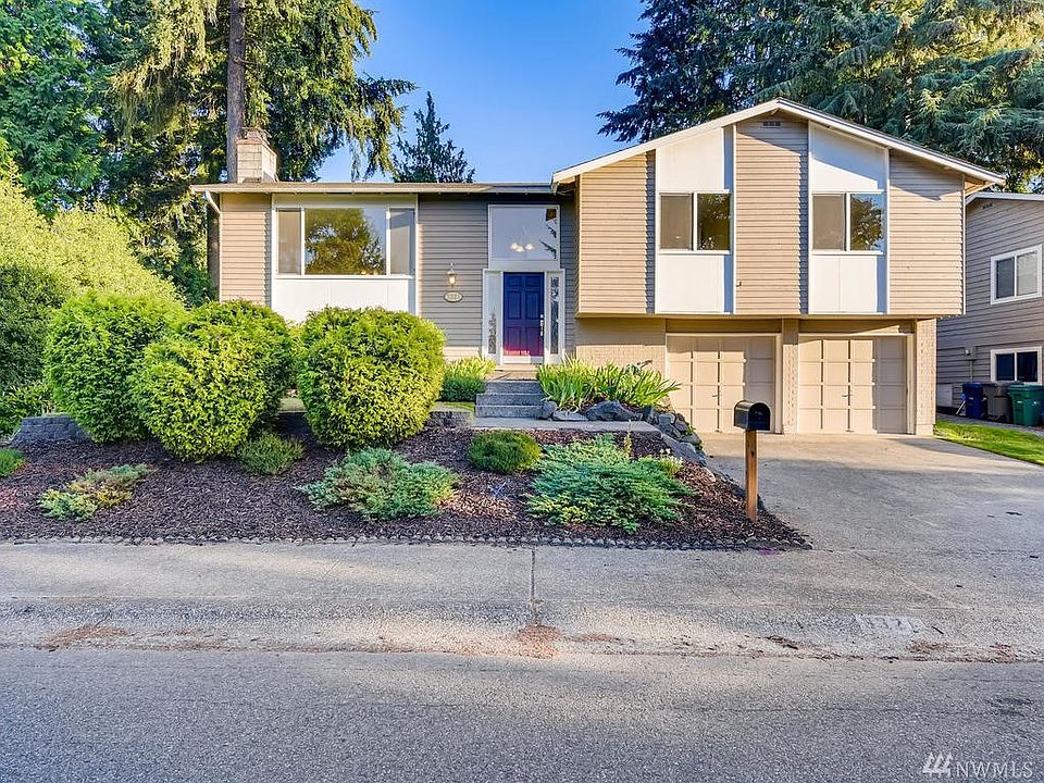 Mature landscaping is featured