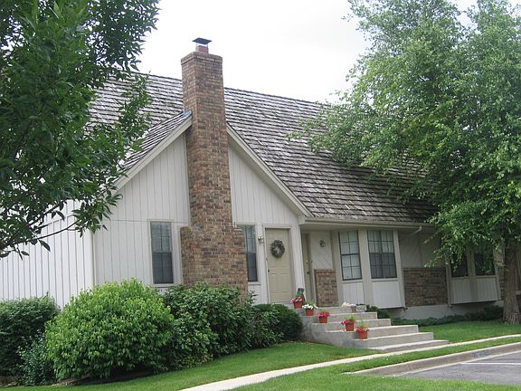 Front of building unit with a fireplace