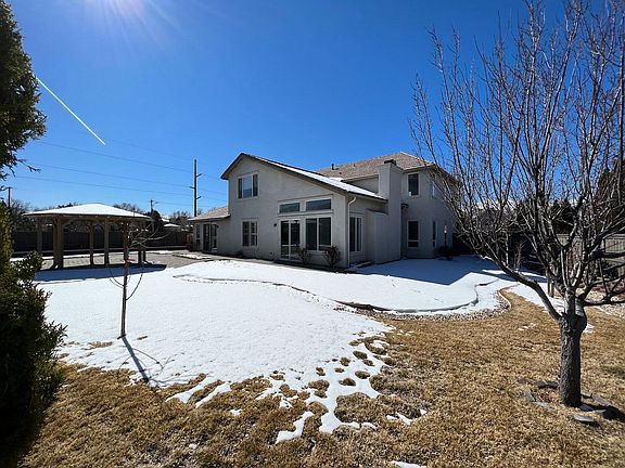 Spacious backyard with gazebo.