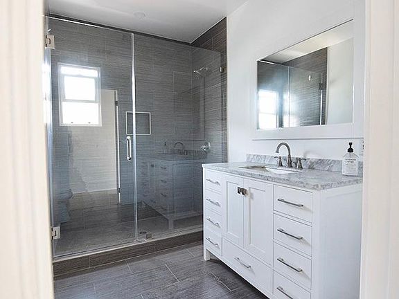 New tile, vanity, and oversized shower