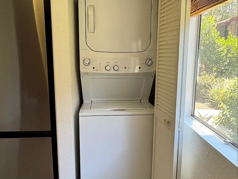 Washer and dryer in unit. Window faces West.