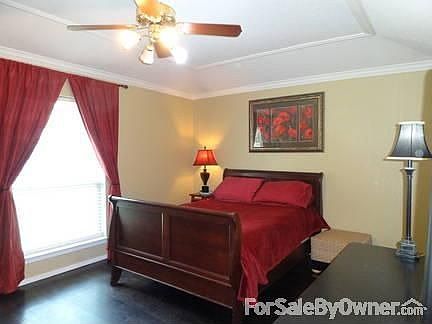 Master bedroom
						:
						Dark chocolate wood floors, tray ceiling and crown molding make this room
