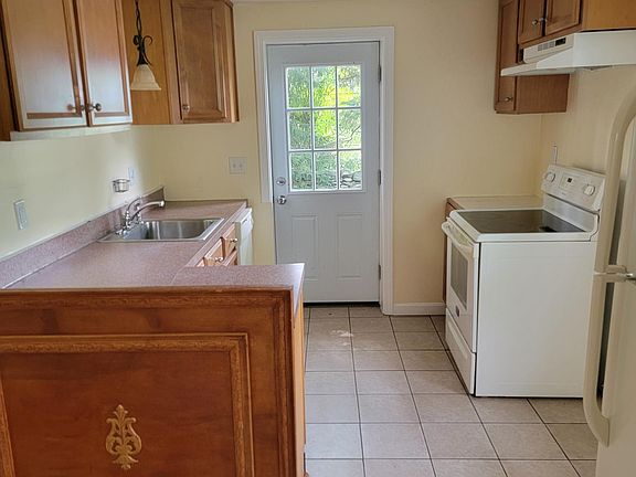 Nice kitchen with dishwasher, stove and fridge.
