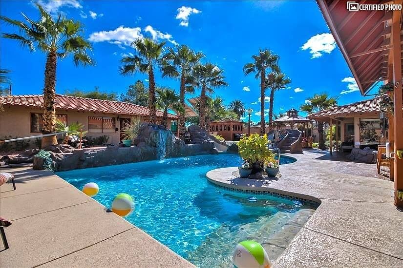 Luxurious deep pool with waterfall & slides