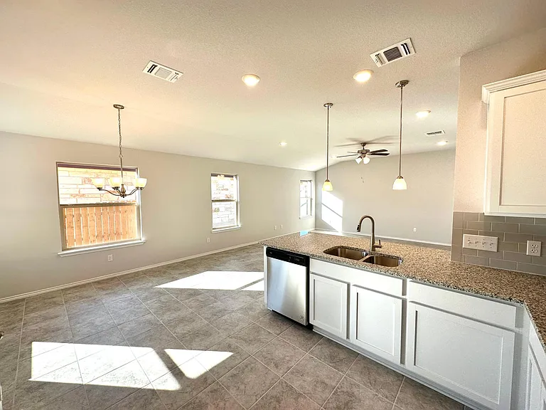 Kitchen opens to dining space