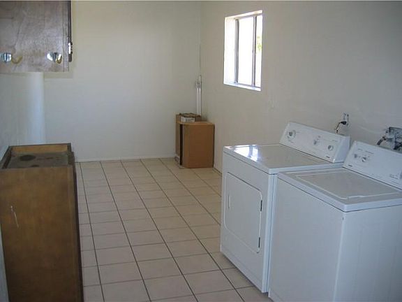 Huge laundry/storage room.