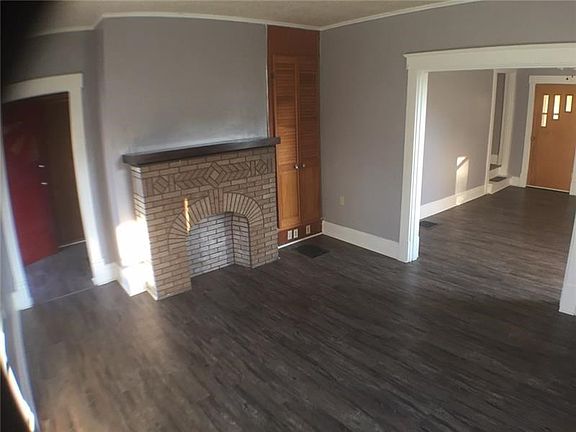 Living Room with NEW laminate, moldings and decorative fire place