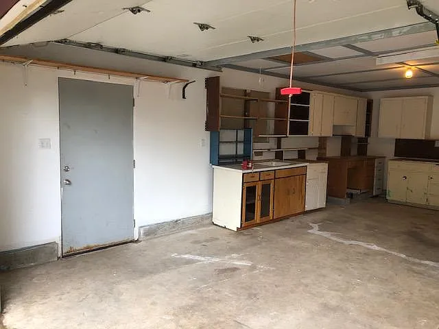 This door goes to the back yard. You do get 2 remotes for the garage and 2 sets of keys to the house.