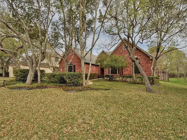 Large oaks surround this home providing great shade and privacy.