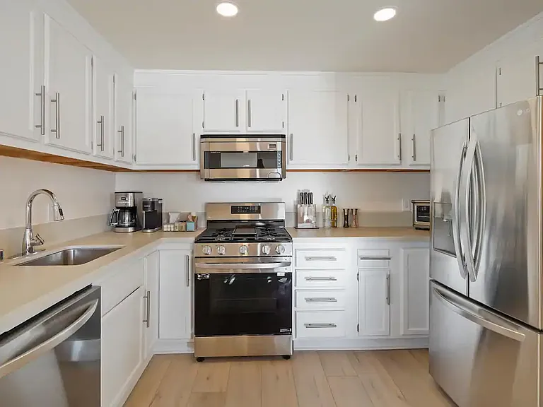 Fully equipped kitchen with top-of-the-line appliances, perfect for preparing your favorite meals.