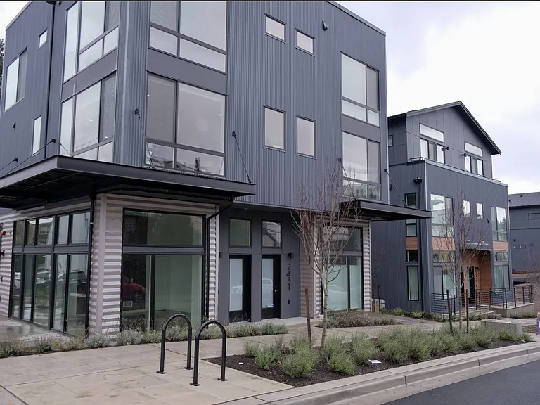 Rental unit and entrance on left side. 1st floor entrance, w/ living on floor 2 and 3 + rooftop deck.