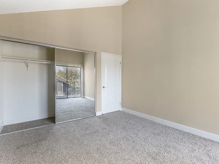 Your sanctuary awaits behind mirrored doors, where every detail, from plush carpeting to spacious closets, promises a haven of tranquility.